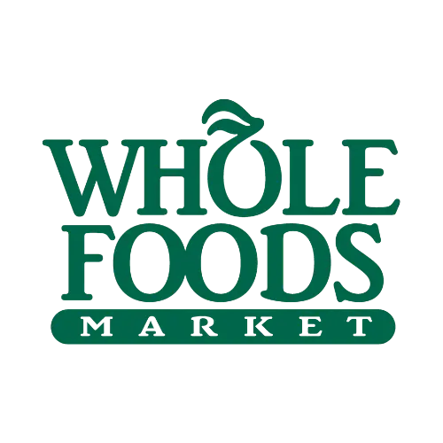 Logo of Whole Foods Market featuring the brand name in green capital letters. The letter O in Whole is stylized with a leaf accent on top. The word Market is written in green on a rectangular background below Whole Foods.